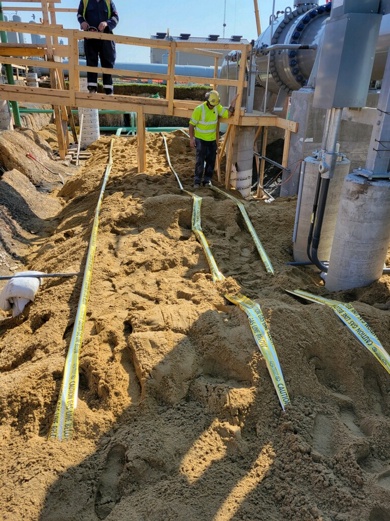 dirt being dug with wood structure being built